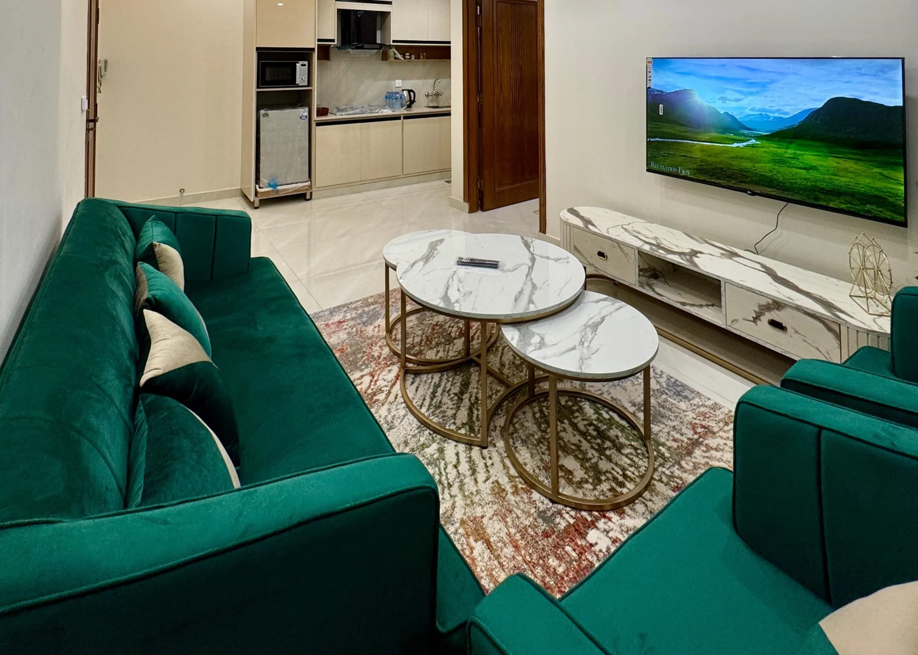 Emerald green lounge and kitchenette at Premium Pavilion