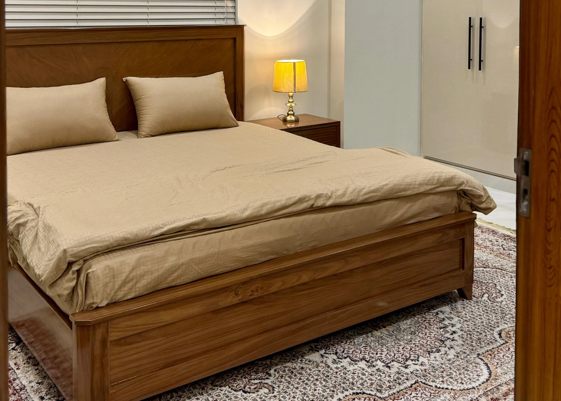 View bedroom with wood headboard