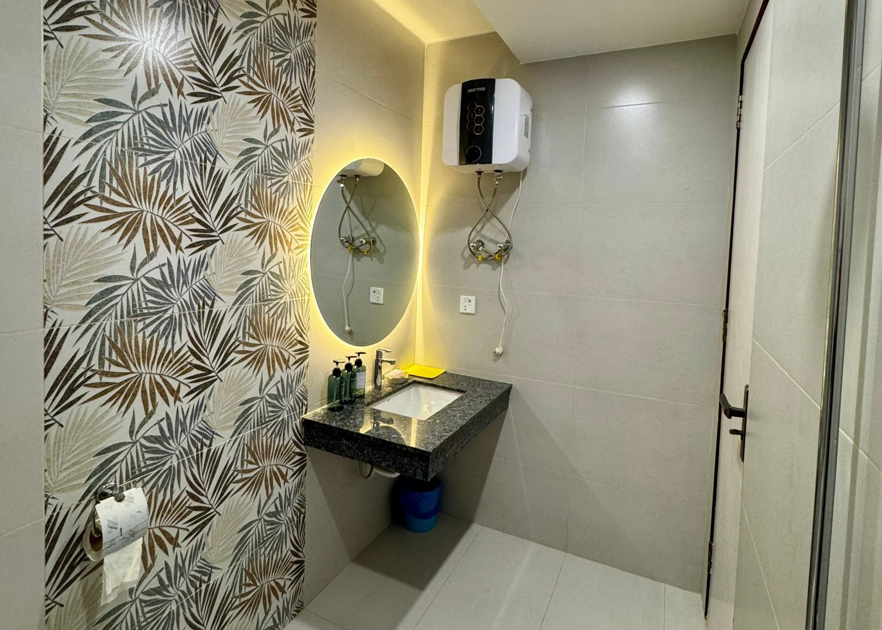 View bathroom with illuminated mirror